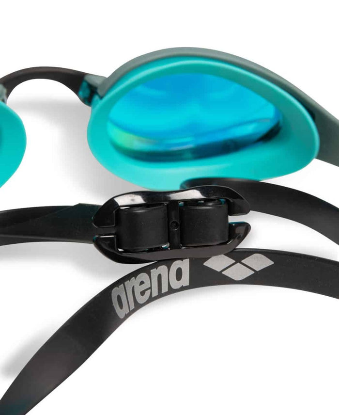 Arena Cobra Ultra Swipe mirror racing goggles in aqua, sage, and peacock colors with reflective lenses.