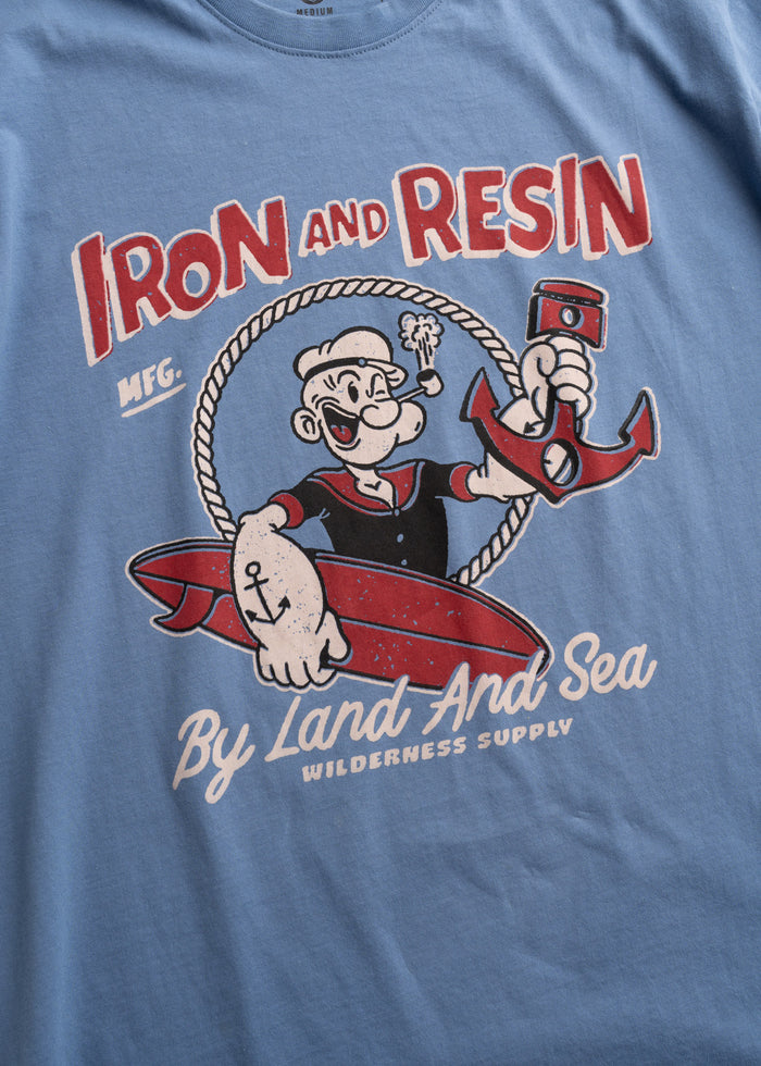 Men’s organic cotton t-shirt in light blue, with custom graphic print and soft feel, lightweight everyday tee