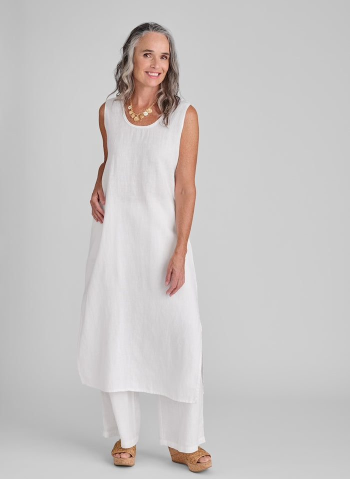 Slipster dress (White) layered over the Flowing Pant (White), size Small. Model is 5'9" tall. 100% Linen.