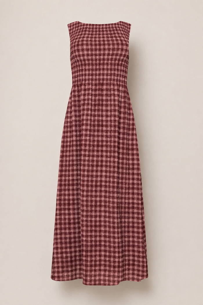 The Ana Dress in Cranberry Popcorn Plaid by Ivy City Co is a sleeveless, ankle-length dress with a maroon and pink checkered pattern, featuring a comfortable smocked bodice and a flared skirt. Displayed on a plain light background, this style is also maternity friendly.