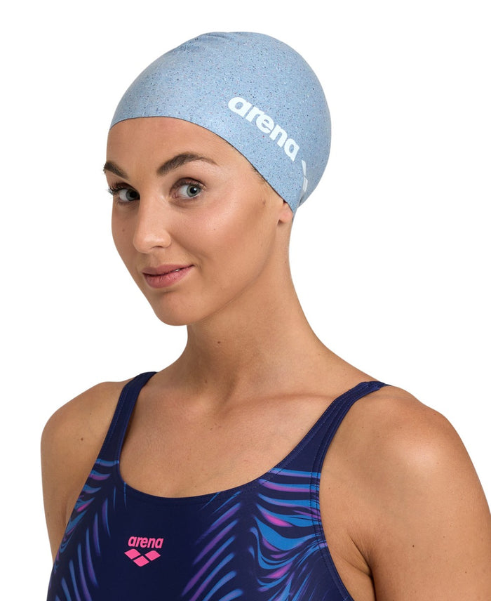 Arena silicone swim cap in vibrant color, snugly fitting for swimmers, designed for comfort and hydrodynamics.