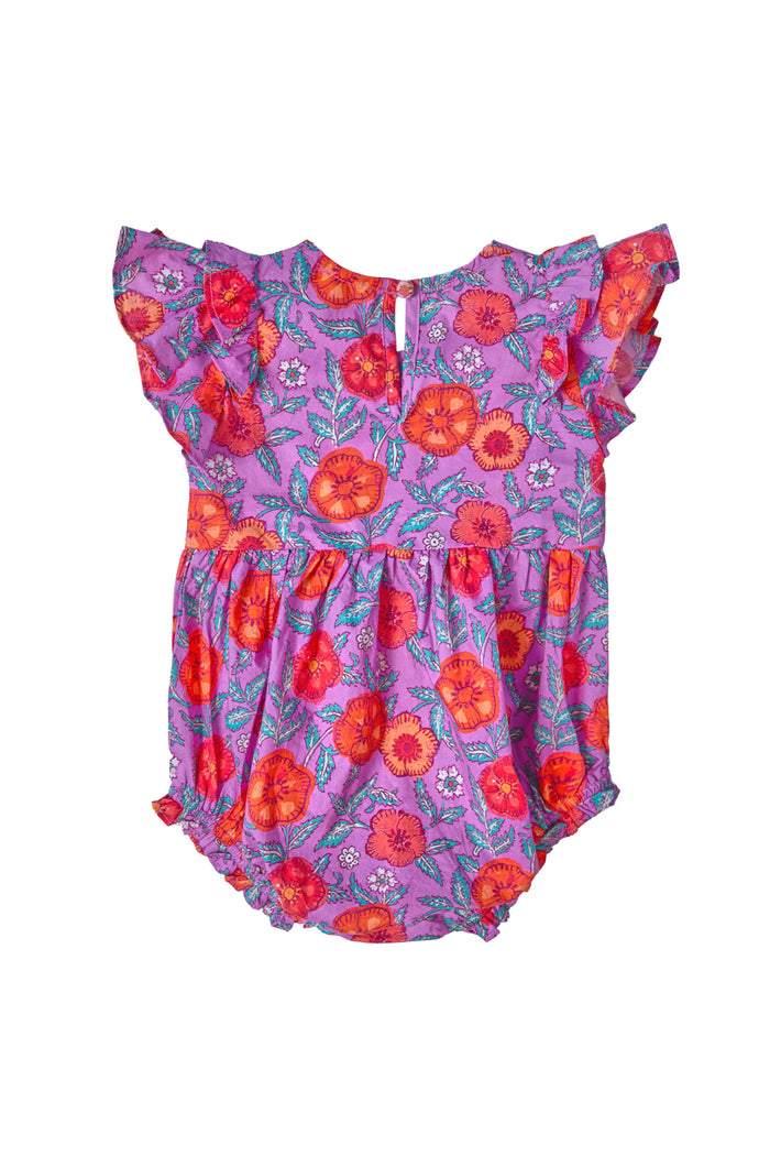 The Baby Hattie Romper in Thistle Flower Poppy Woodblock by Ivy City Co features a smocked bodice, ruffled sleeves, and vibrant red and orange florals with green leaves. It has a gathered waist and a convenient button closure at the back.
