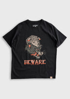 Black T-shirt featuring a fierce wolf in sheep's clothing design with "BEWARE" text. Iron & Resin branding below.