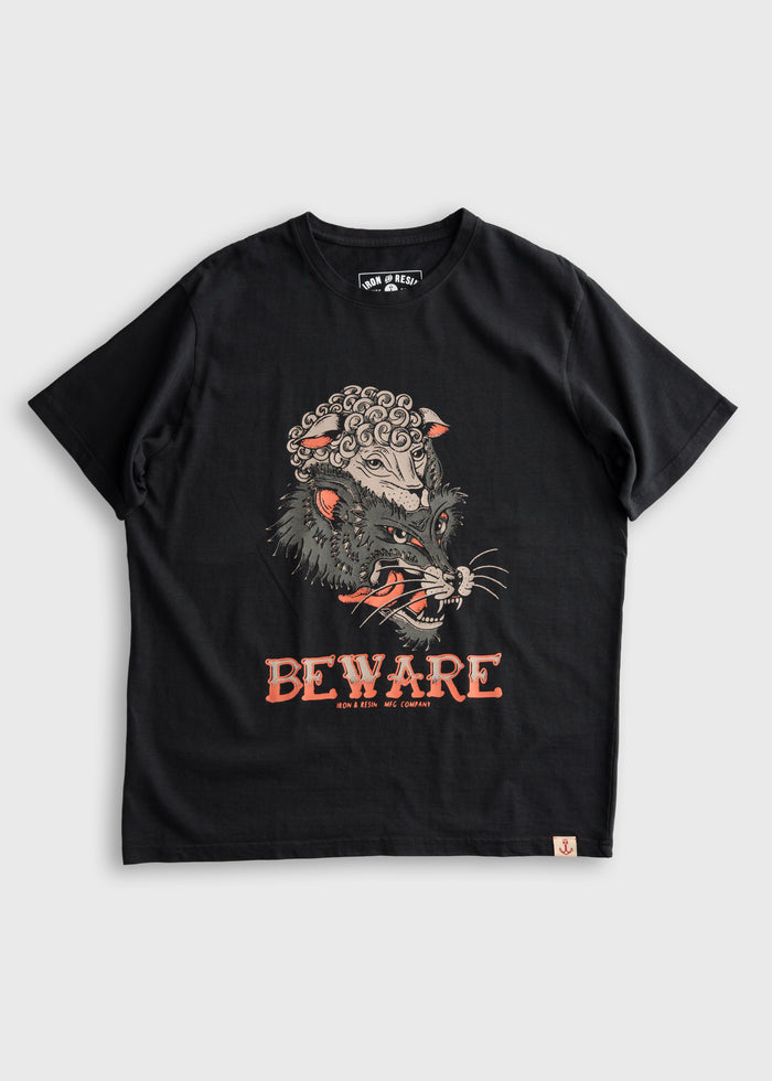 Black T-shirt featuring a fierce wolf in sheep's clothing design with "BEWARE" text. Iron & Resin branding below.