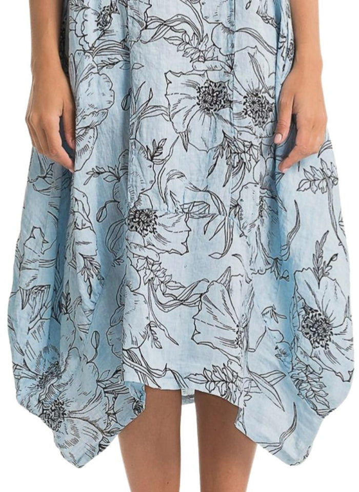 Featuring wide curved hemline, longer on the sides, and shorter in the center.  Lands between Mid-length and Maxi, depending on your height.  Model shown is 5'9" tall.