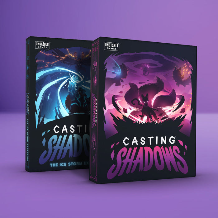 Two "Casting Shadows: Base Game + The Ice Storm Expansion Bundle" boxes from Unstable Games sit on a purple backdrop; one features a blue ice theme labeled "The Ice Storm Expansion," while the other has a purple shadow design, inviting thrilling tactics and imaginative play.