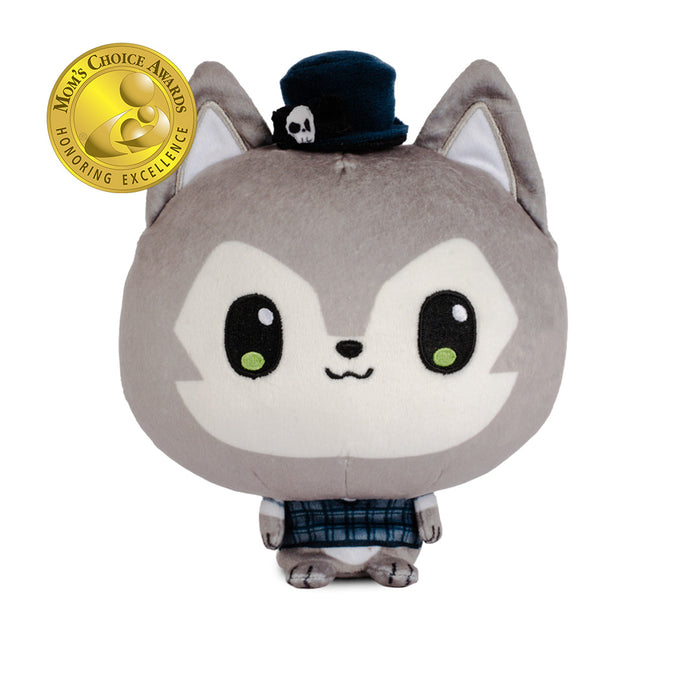 A plush toy of a cute gray wolf wearing a small black top hat with a white skull detail and a blue plaid shirt.