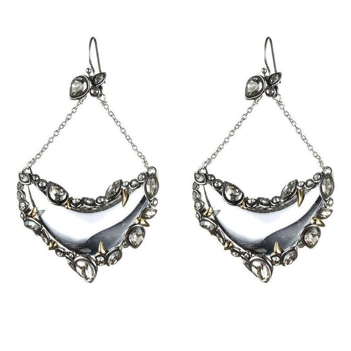Silver crescent earrings with crystals and gold accents; statement jewelry.