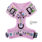 Sassy Woof’s Dog Adjustable Harness - Hello Kitty® & Friends Flower Festival features pink mesh, colorful cartoon animals and stars, black buckles, a leash ring, and a “patented” label on the right side.