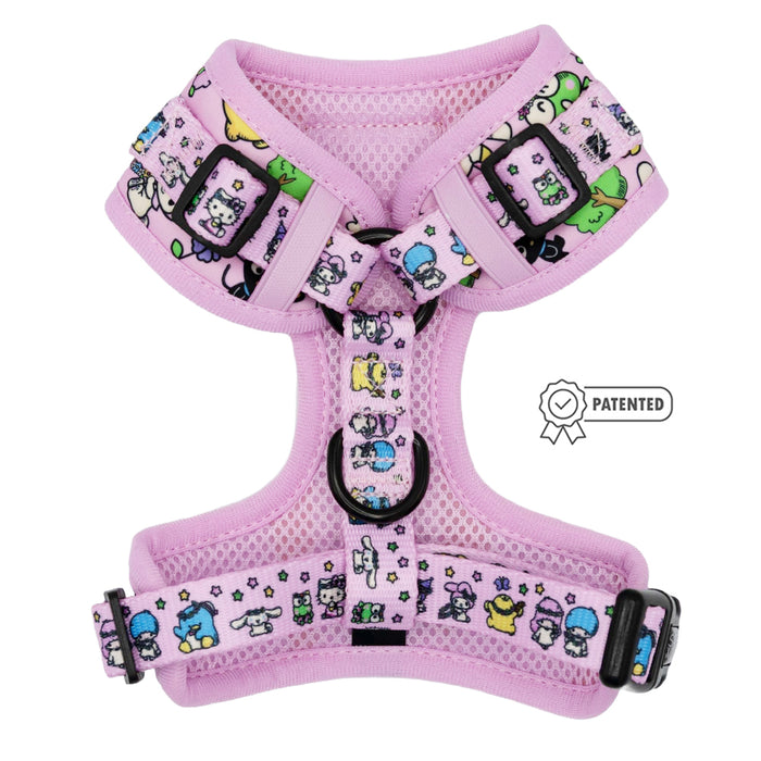 Sassy Woof’s Dog Adjustable Harness - Hello Kitty® & Friends Flower Festival features pink mesh, colorful cartoon animals and stars, black buckles, a leash ring, and a “patented” label on the right side.
