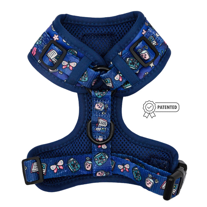 The Sassy Woof Dog Adjustable Harness - Spellbound is a blue mesh harness with adjustable straps, nautical and animal designs, black buckles/rings, and a Patented badge.