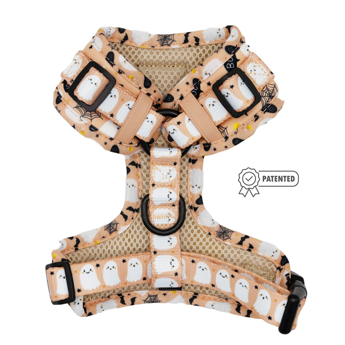 The Sassy Woof Dog Adjustable Harness - Squad Ghouls features a beige and white design with cute ghost prints, black buckles, a patented symbol, adjustable straps, and breathable mesh for no pull comfort.