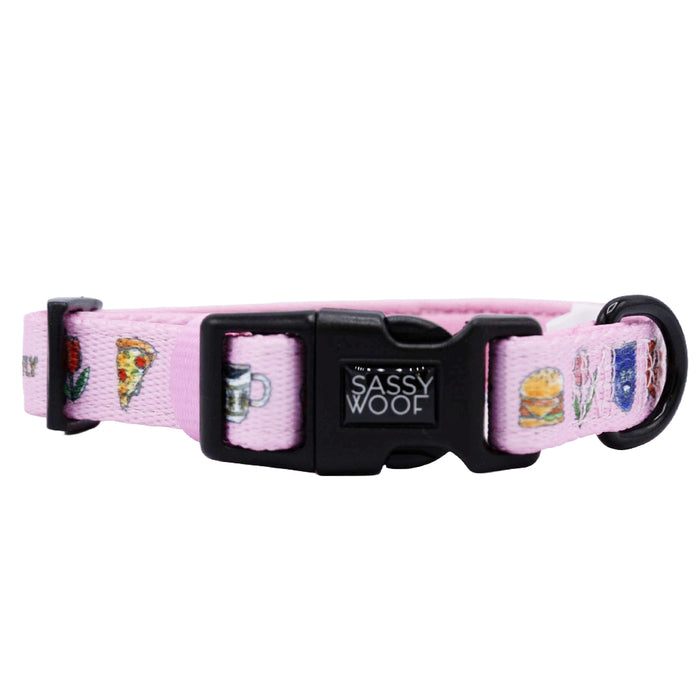 The Sassy Woof Dog Collar - Gilmore Girls™ features light pink adjustable neoprene, a black buckle and D-ring, and fun food icons—ideal for any Gilmore Girls fan. Part of the Stars Hollow pet collection.