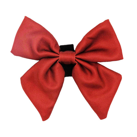 The Sassy Woof Dog Sailor Bow - Burgundy features a red fabric bow with two loops, pointed tails, and a black band—ideal for pairing with an adjustable harness or other dog accessories. Shown on a white background.