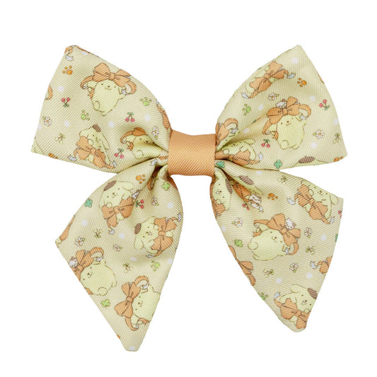 The Dog Sailor Bow - Pompompurin™ by Sassy Woof is a beige fabric bow adorned with adorable animals, flowers, and mushrooms plus a light brown center—perfect for pairing with an adjustable harness or matching leash.