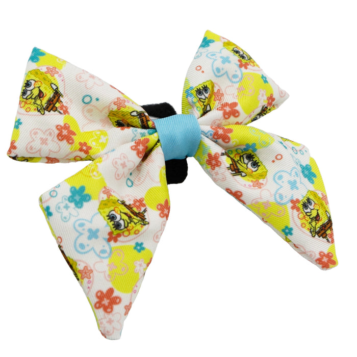 The Sassy Woof Dog Sailor Bow - SpongeBob SquarePants™ Bikini Bottom features a white bow with a light blue center and colorful floral SpongeBob designs—ideal to pair with matching SpongeBob dog accessories.