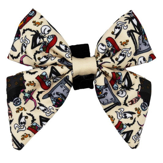 The Sassy Woof Dog Sailor Bow - The Nightmare Before Christmas™ (Beige) features cartoon skeletons on a beige and black background, some with hats and red accents—perfect for adding spooky style to your dog's collar.