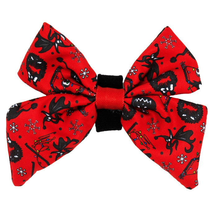 The Dog Sailor Bow - The Nightmare Before Christmas™ (Red) by Sassy Woof features playful cartoon monsters, snowflakes, and red accents—perfect for fans of the iconic Pumpkin King and this festive movie!.