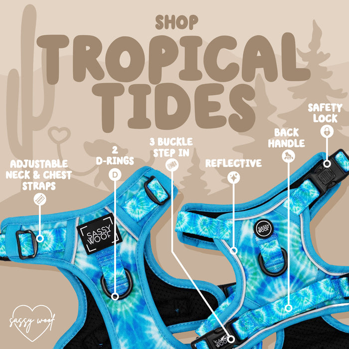 The Sassy Woof Dog Step-in Harness – Tropical Tides features a bright blue tie-dye design, adjustable neck and chest, two D-rings, reflective details, three-buckle step-in fit, safety lock, and back handle. Shop Tropical Tides!.