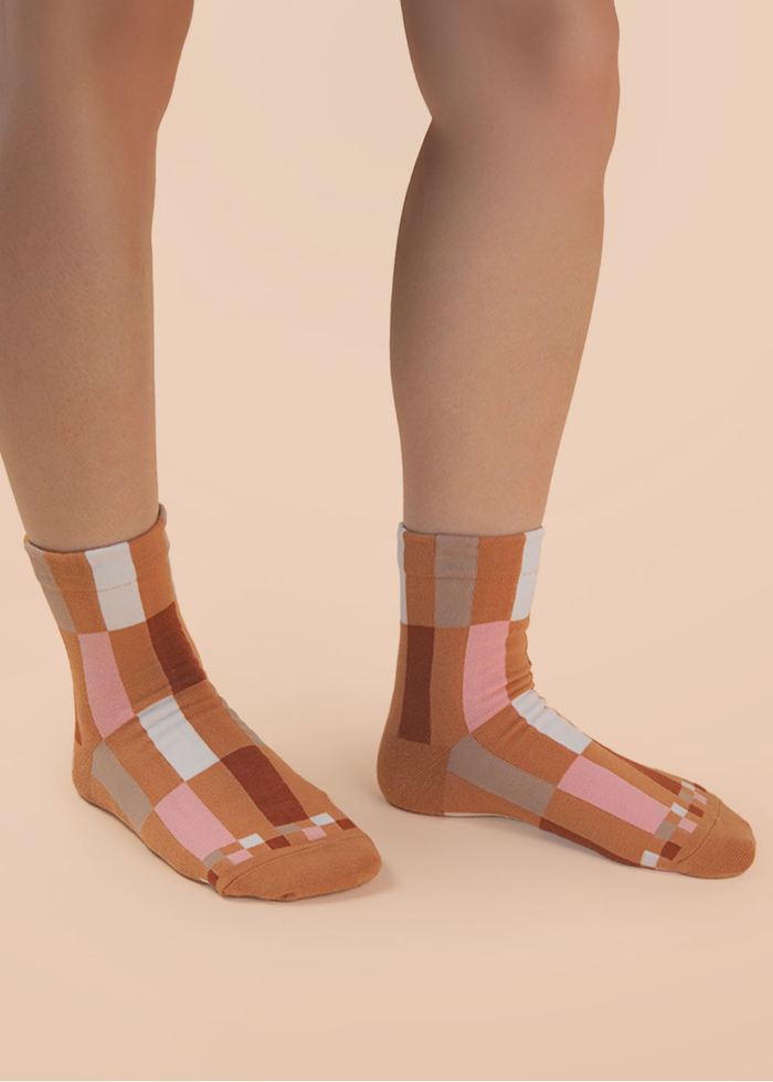 Person wearing brown colorblock socks