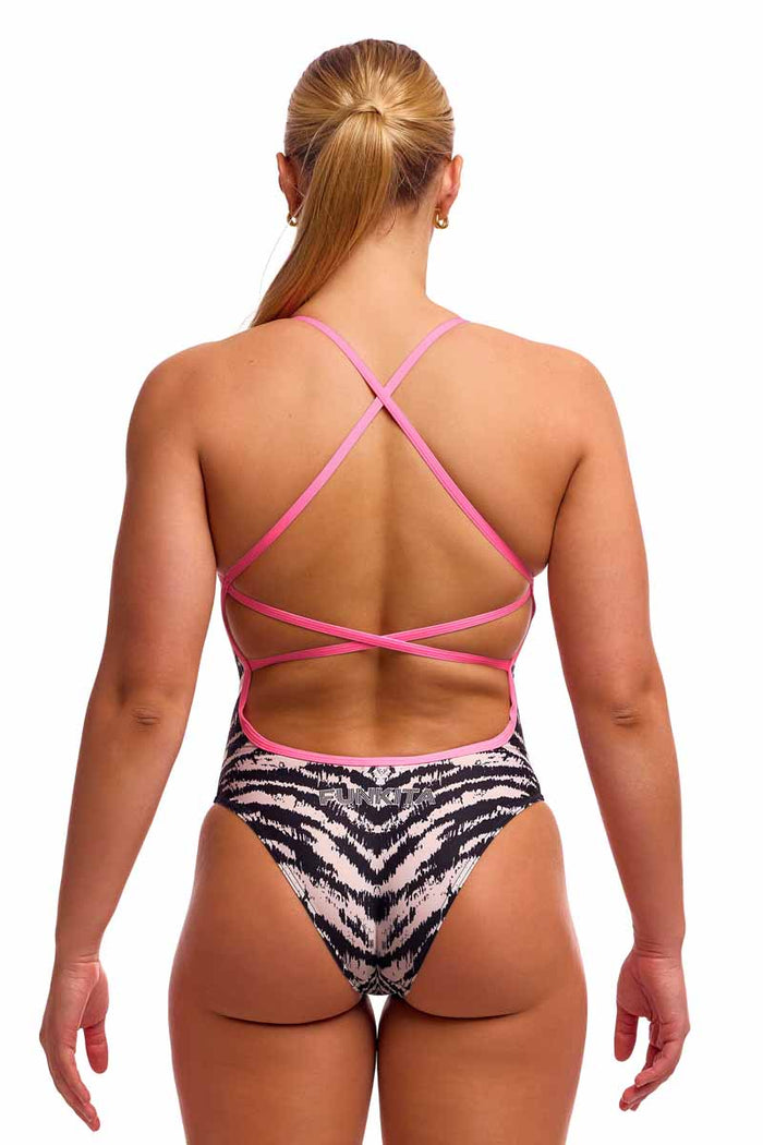 Funkita Ladies Fur Elise white and black one-piece swimsuit with strappy design, shown on a model.