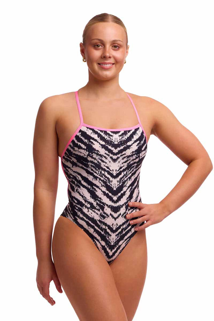 White and black Funkita Ladies Fur Elise strapped one-piece swimsuit displayed on a mannequin, showcasing the stylish design.