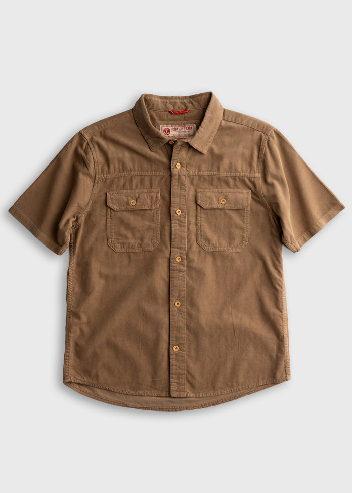 Brown short-sleeve button-up shirt with two chest pockets on a plain background, showcasing casual style and design.