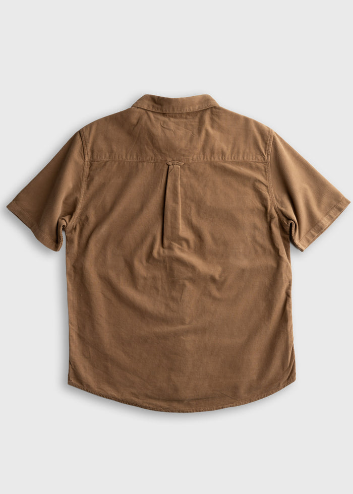 Brown short-sleeve shirt with a back pleat, laid flat on a light gray background, showcasing its casual style and design.