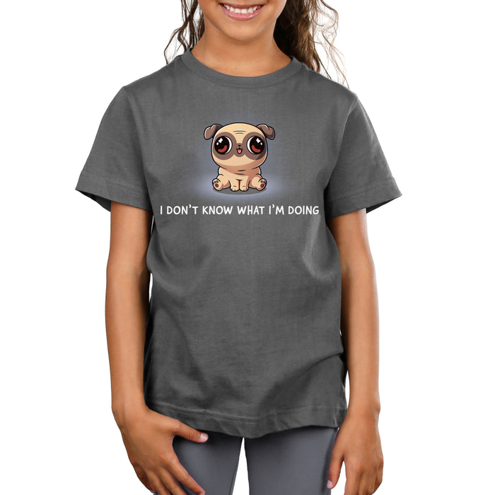 Premium Cotton T-shirt_TeeTurtle charcoal gray I Don’t Know What I’m Doing apparel featuring a sitting pug with large eyes looking in different directions.