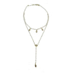 Delicate layered necklace featuring an evil eye charm and rose quartz beads.