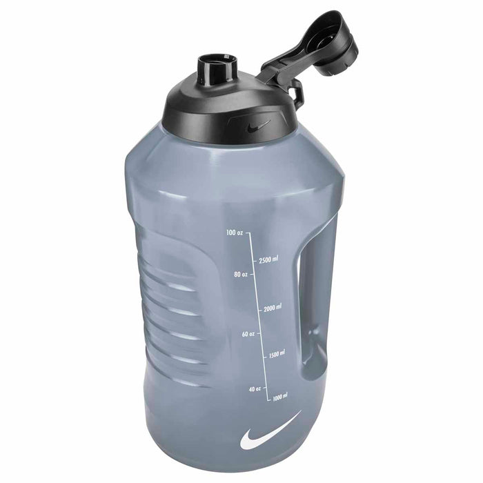 Nike Super Jug 128oz water bottle in anthracite, black, and white with a large capacity and durable plastic construction.