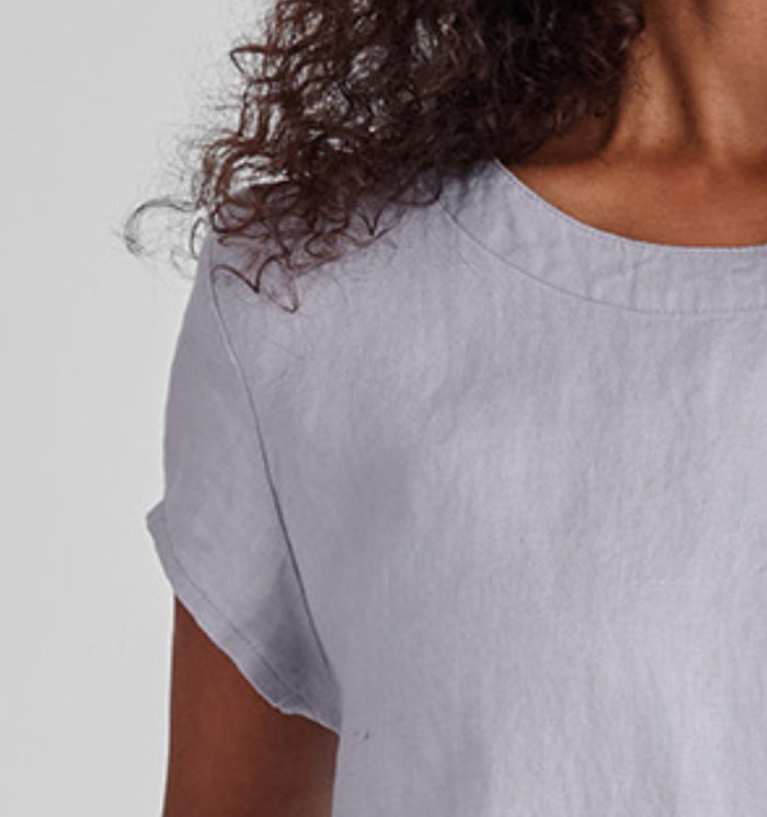 Tuck Back Dress, shown in Platinum.  Zoomed in on the neckline and cap sleeve detail.